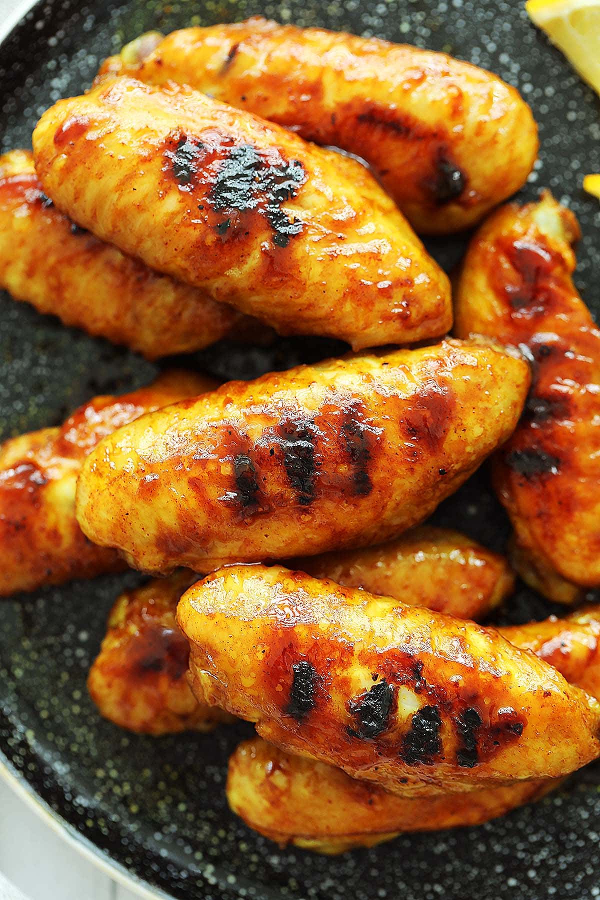 Easy honey glazed chicken wings with grill marks. 