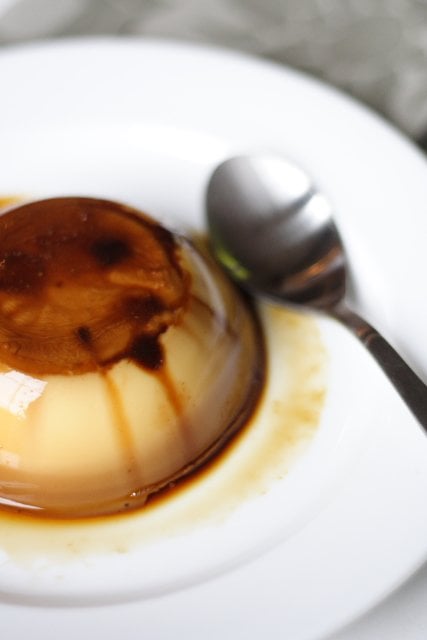 Flan cake or leche flan on a white plate.