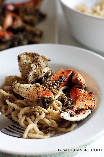 Savory Dungeness crab and garlic noodles served on a plate. 