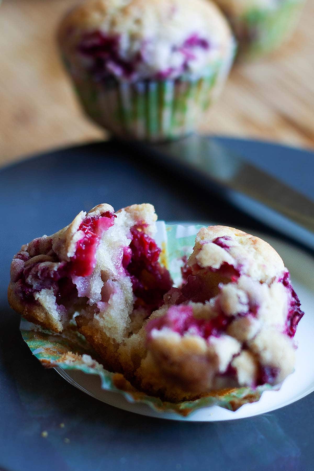 Raspberry muffins loaded with fresh raspberries.