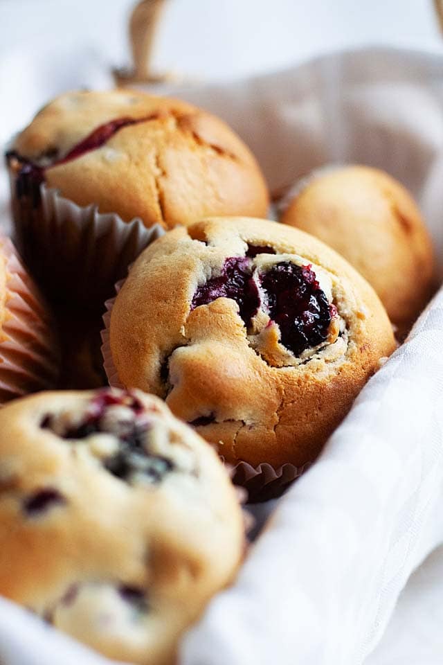 Blueberry muffins in a serving basket.