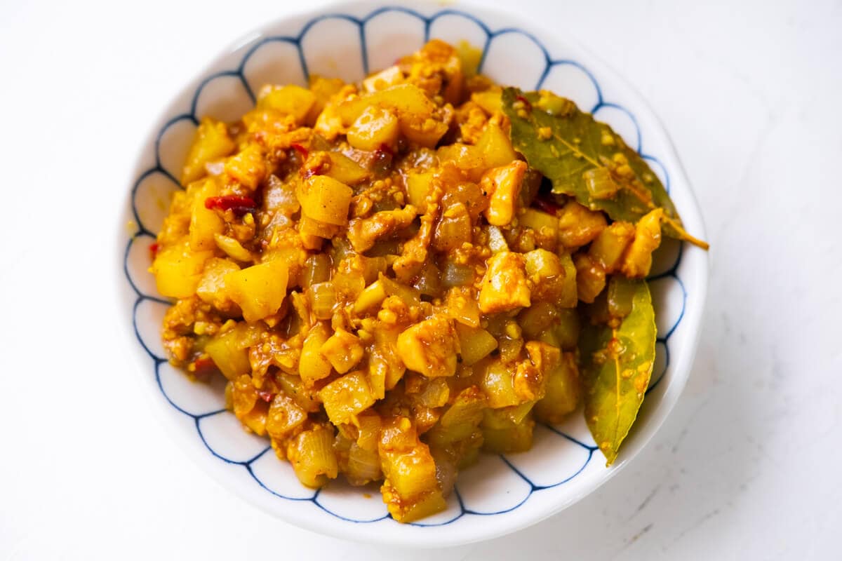 Cooked curry puff filling in a bowl. 