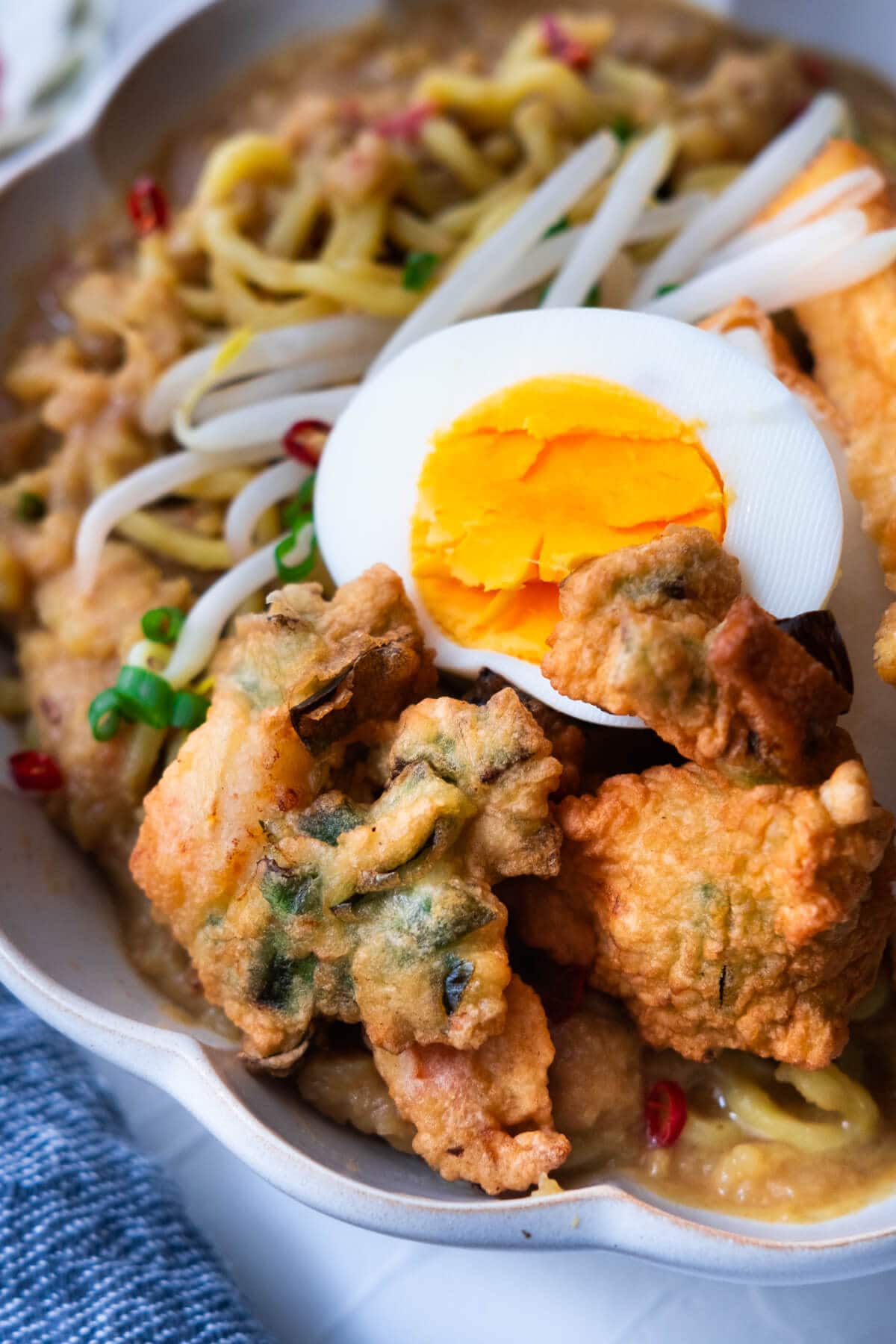 Prawn fritter and boiled egg on the mee rebus. 