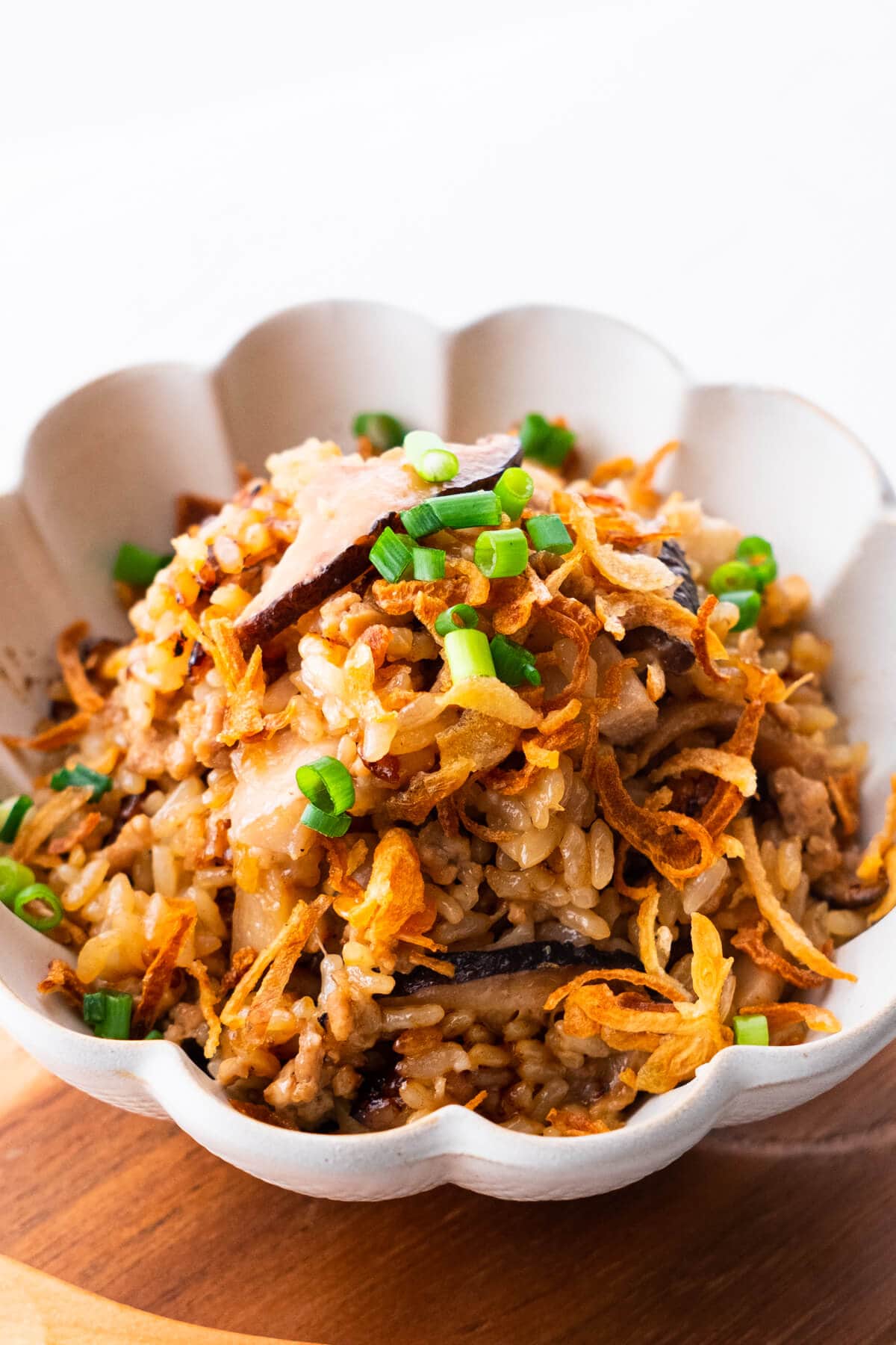 Taro rice topped with scallion, fried onion.