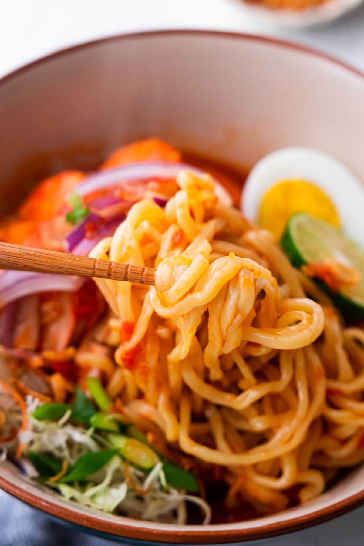 Malay prawn noddle picked with chopstick. 