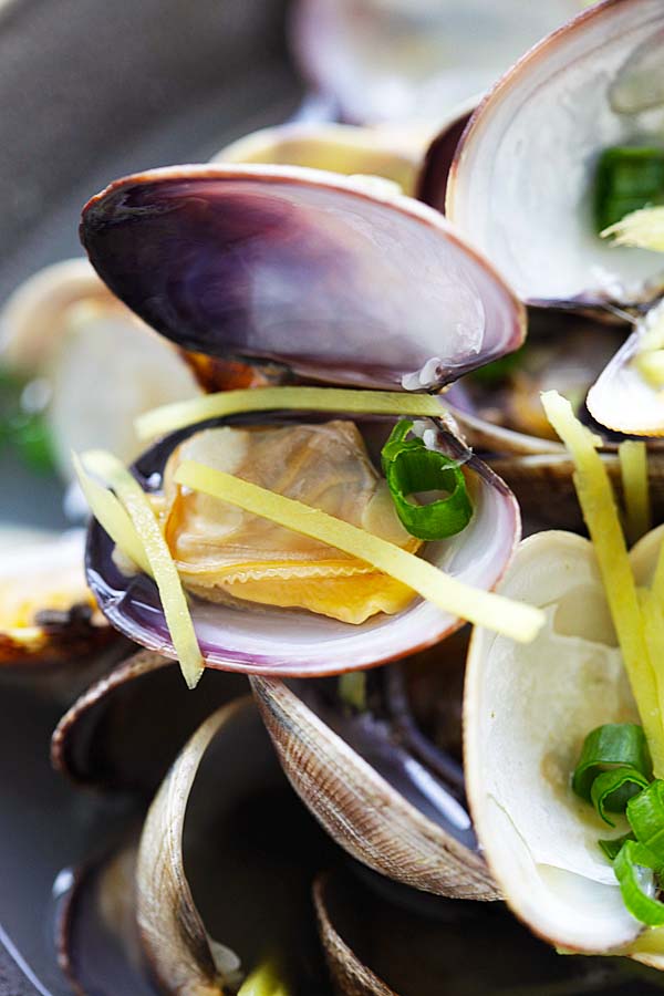 Close up Chinese style soup with clams and ginger, ready to serve.