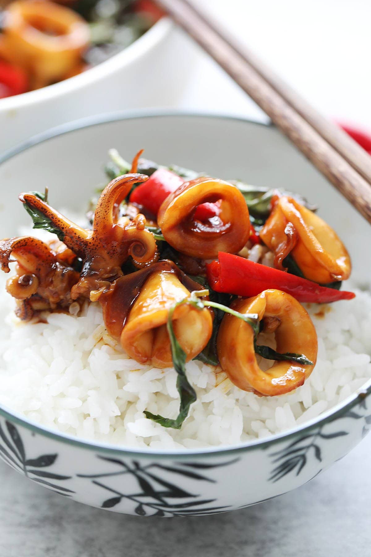 Chinese style stir fry squid served on a bowl of rice.