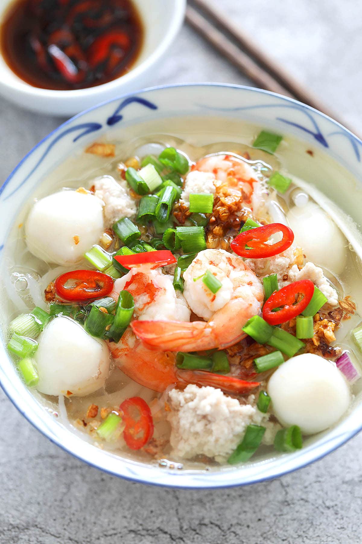 Rice noodle soup topped with shrimp, fish balls, ground pork, scallion and garlic oil.