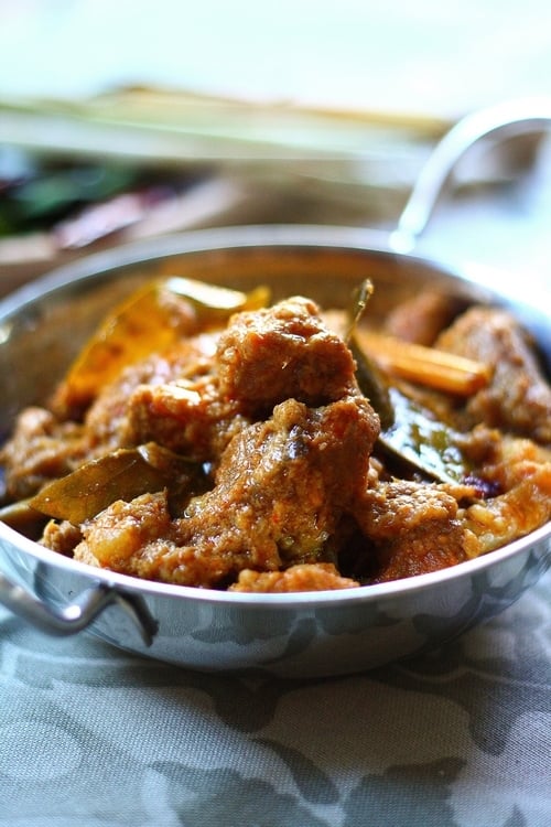 Lamb rendang served in a silver platter. 