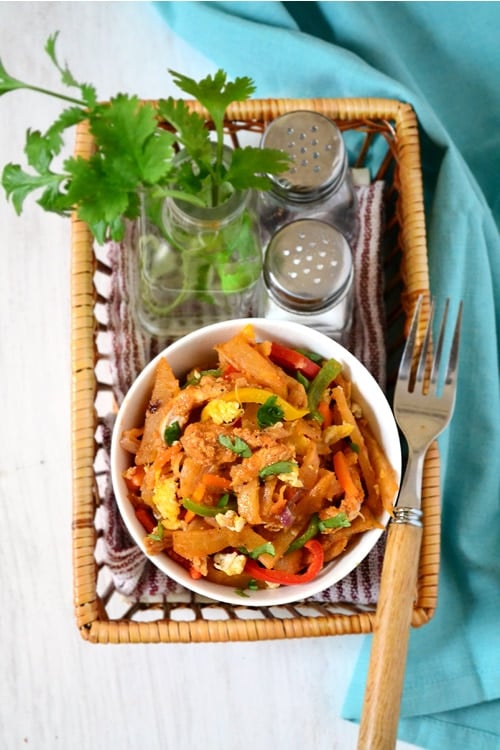 Sri Lankan kottu roti dish made with shredded roti, meat, curry and vegetables.