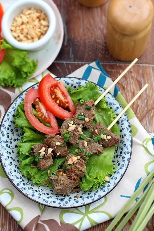 Easy and quick summer Cambodian grilled lemongrass beef skewers in a plate.