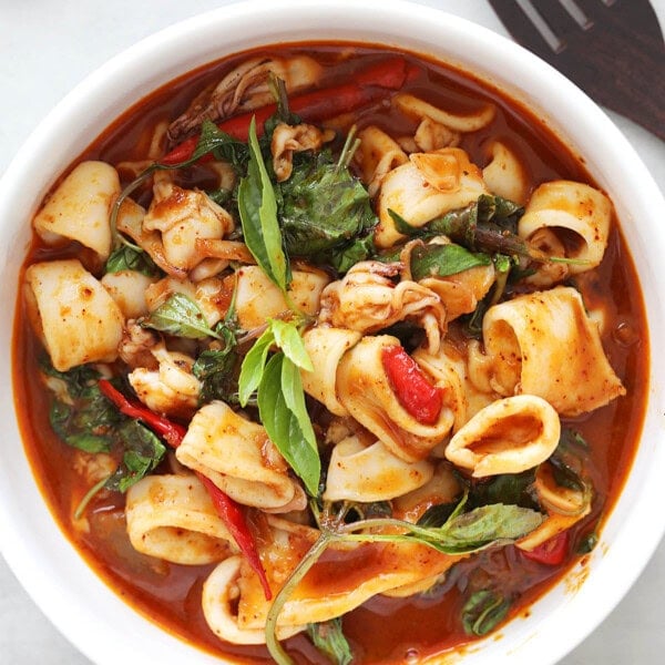 Thai squid recipe with spicy sauce, Thai basil and chilies.