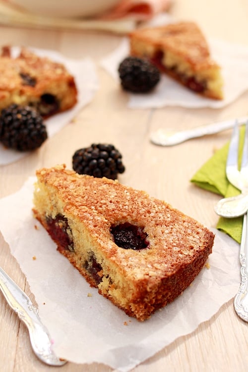 Slices of buttermilk cake with blackberries.