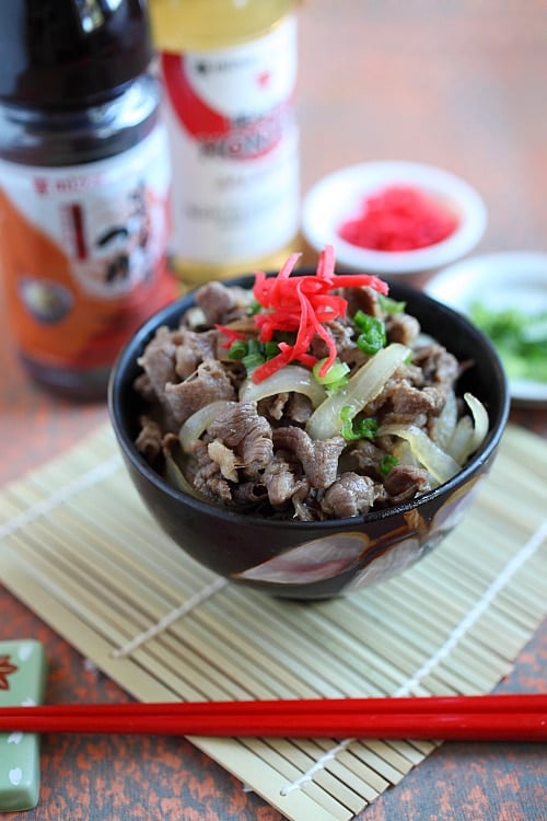 Bowl of Japanese Beef Bowl (Gyudon) with onion scallions and pink beni shoga.