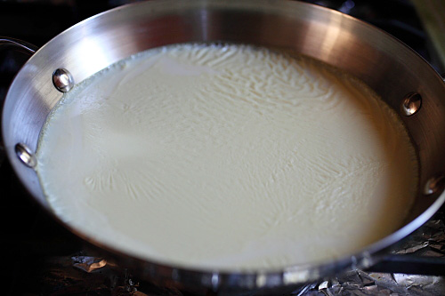 Soy milk in a skillet.