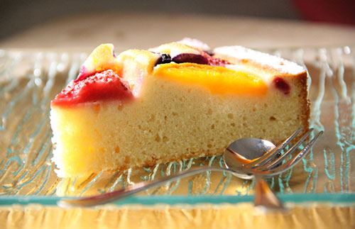 A slice of fruity pastry cake, ready to serve.