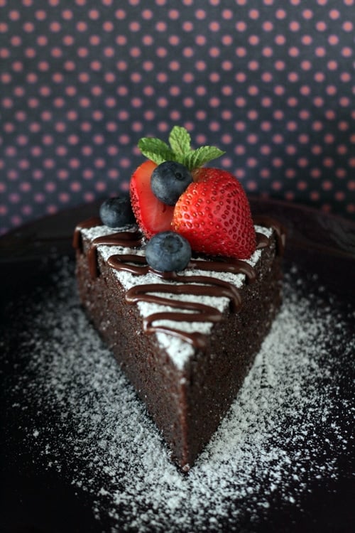 Easy and quick no bake chocolate cake decorated with fresh berries.