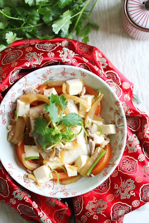 Easy Chinese Teochew steamed fish served in a plate.