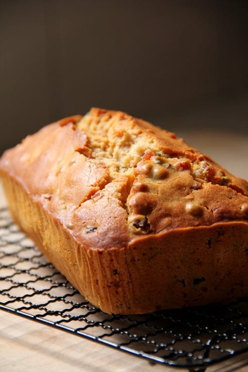 Easy and healthy homemade festive Irish mixed fruits tea bread loaf placed on a cooling rack.