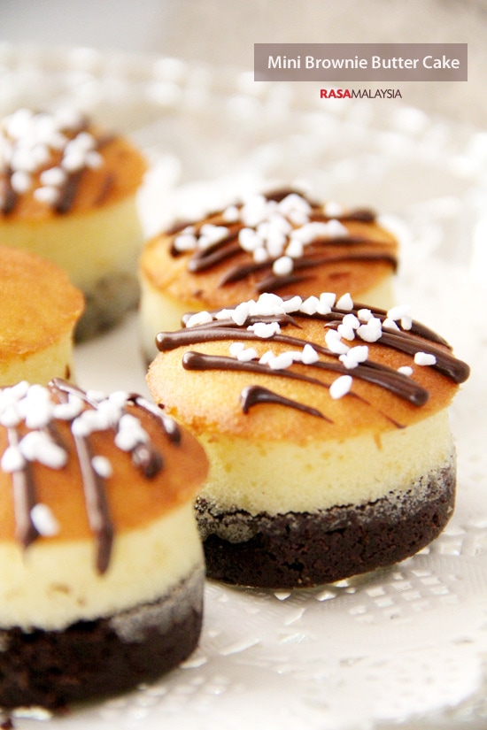 Easy and delicious homemade mini brownie butter chocolate cake topped with chocolate sauce and sprinkles.