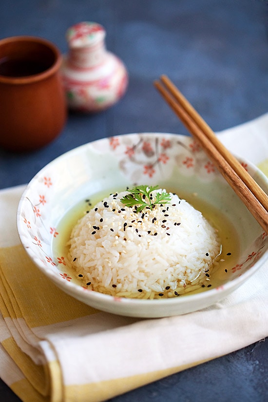 Japanese green tea rice served in a bowl with a pair of chopsticks. 