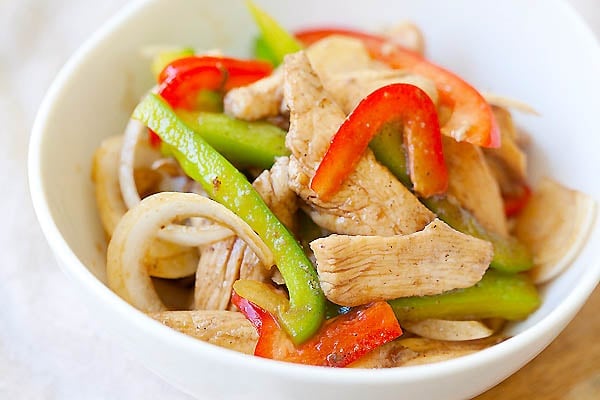 Yummy Asian stir-fry chicken with bell peppers serve in a bowl.