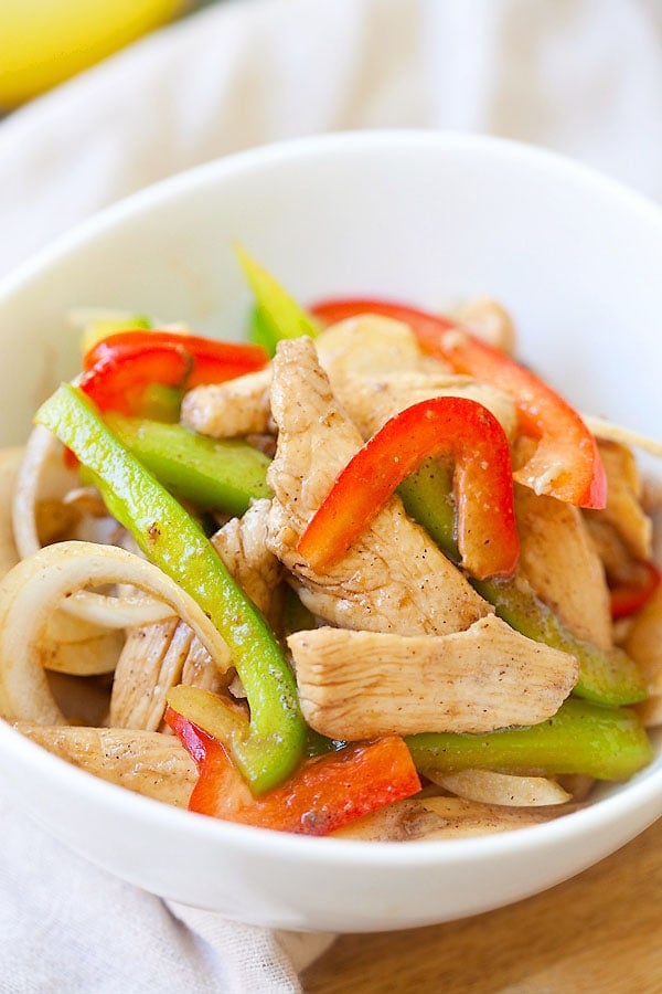 Easy Asian black pepper chicken stir fry in a bowl with bell peppers.