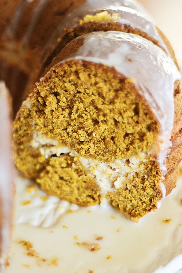 Close up voew of sliced pumpkin cream cheese bundt cake.