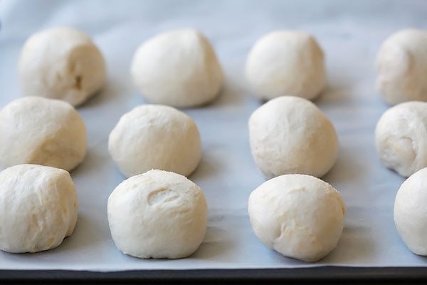 Delicious and healthy homemade cheese bomb biscuits loaded with Mozzarella cheese and topped with garlic herb butter, pre-baked.