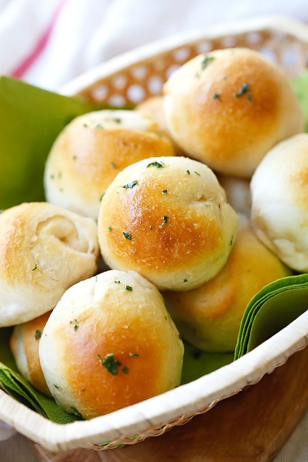 Garlic Herb Cheese Bombs biscuits loaded with Mozzarella cheese and topped with garlic herb butter served in a basket.