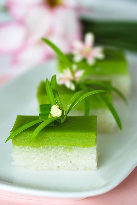 Seri Muka dessert, a Malaysian kuih (sweet cake) made of glutinous rice, coconut milk, sugar and pandan leaves, served in a dessert plate.