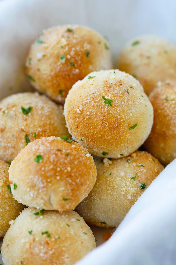 Easy and amazing homemade cheese bomb biscuits loaded with Cheddar cheese and topped with Parmesan cheese.