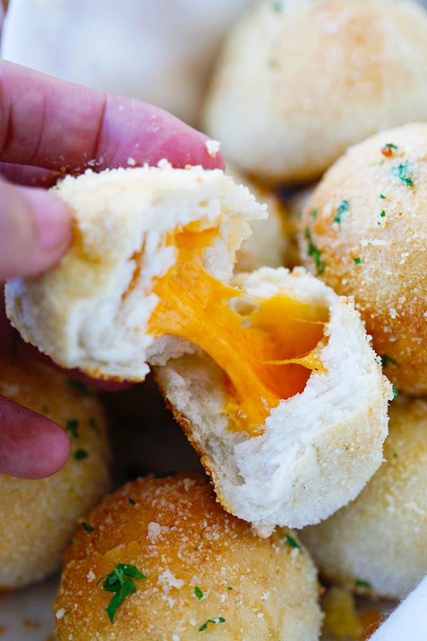 Easy Cheddar Cheese Bombs with garlic butter, Cheddar cheese and topped with Parmesan cheese.