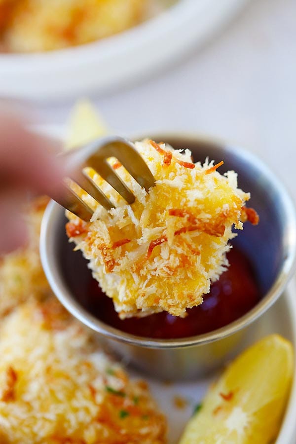 Homemade crispy cod fish nuggets with a fork.