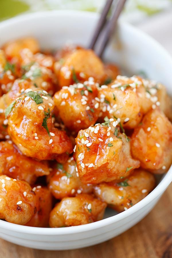 Sweet chili chicken bites in a bowl.