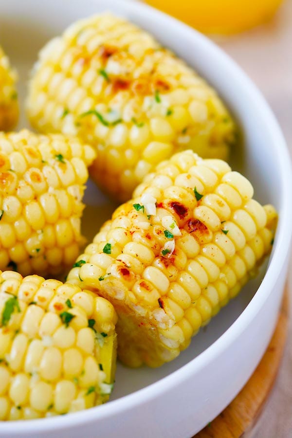 Close up grilled Garlic-Herb Butter Roasted Corn ready to serve.