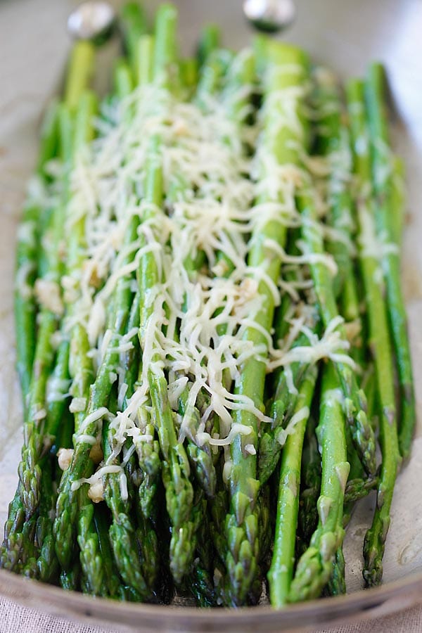 Sauteed Parmesan Asparagus with Parmesan cheese on a skillet.