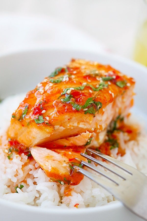 Quick and easy Sweet Chili Salmon cut open with a fork.