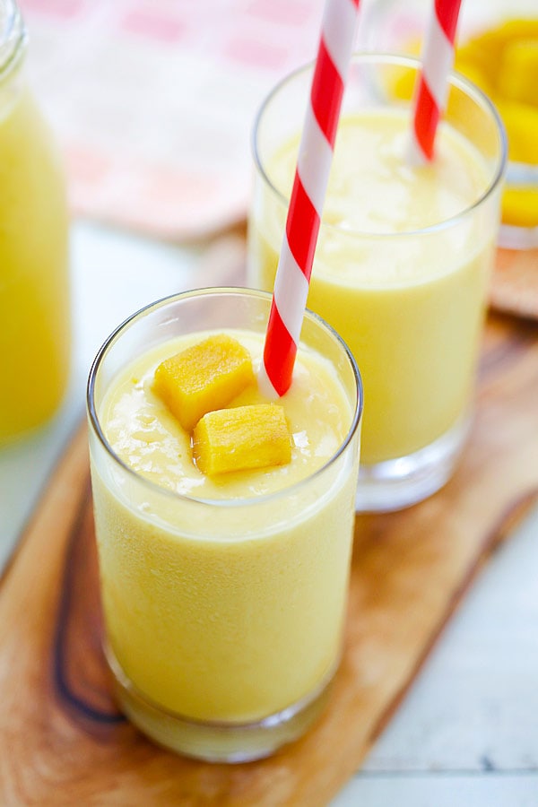 Mango Lassi - a rich, popular Indian smoothie with fresh mango, yogurt and honey. Easy recipe that takes 10 mins to make! | www.666630.xyz