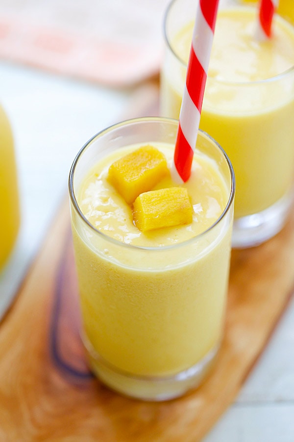 Mango Lassi - a rich, popular Indian smoothie with fresh mango, yogurt and honey. Easy recipe that takes 10 mins to make! | www.666630.xyz