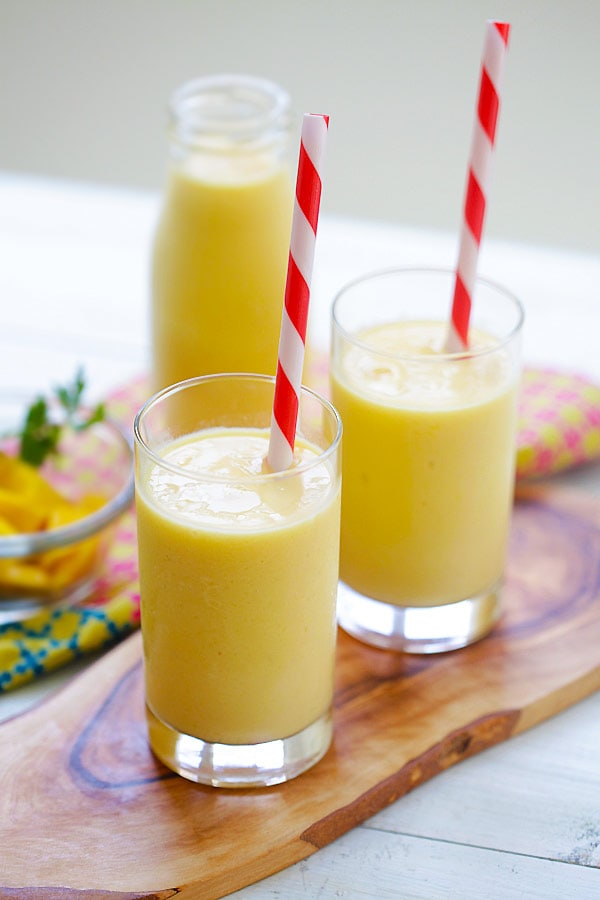 Mango Lassi - a rich, popular Indian smoothie with fresh mango, yogurt and honey. Easy recipe that takes 10 mins to make! | www.666630.xyz