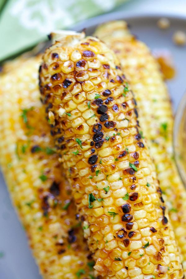 Homemade easy roasted Basil Butter Corn with homemade basil butter ready to serve.