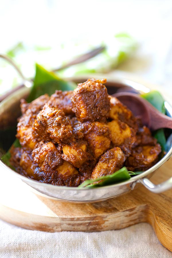 Homemade Malaysian-Indonesian chicken stew with spices and coconut milk in a silver cook ware ready to serve.