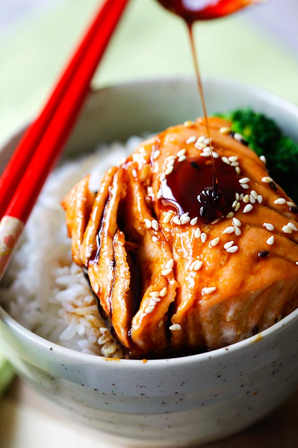 Teriyaki sauce is drizzled over the salmon. 