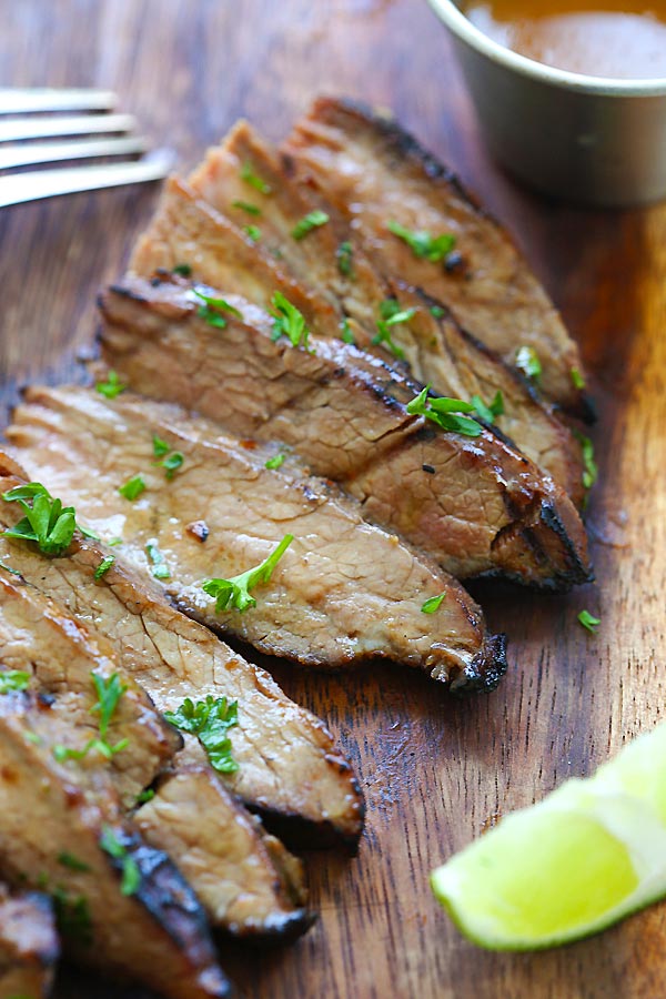 Tender and juicy steak marinated with honey sriracha butter sliced into pieces.