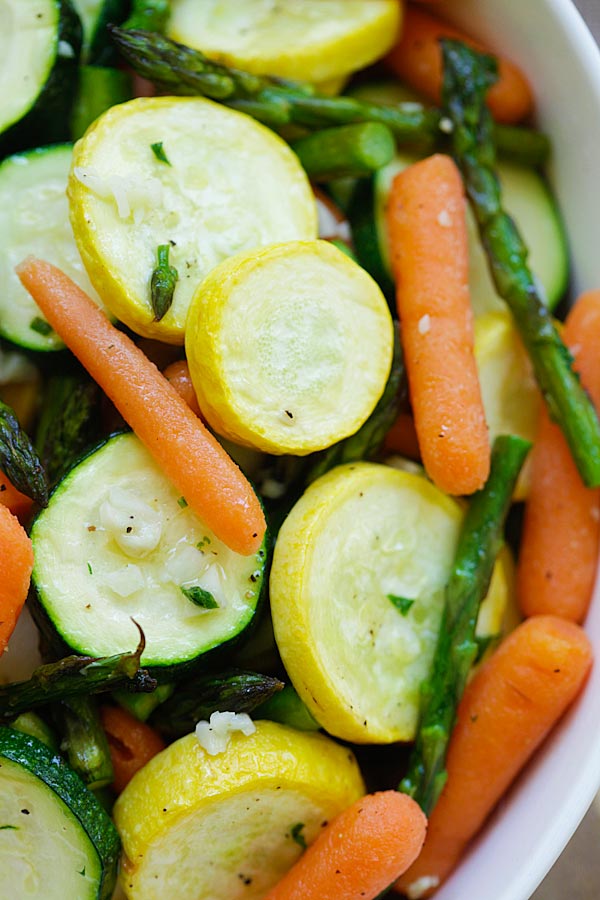 Close up roasted spring vegetables ready to serve.