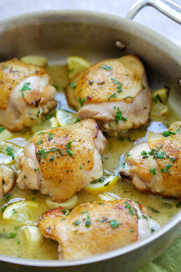 Homemade pan fried lemon chicken in a pan.