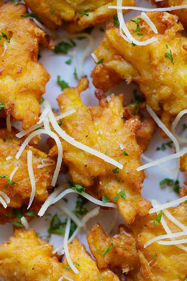 Close up cheesy and crispy Parmesan pumpkin fritters.