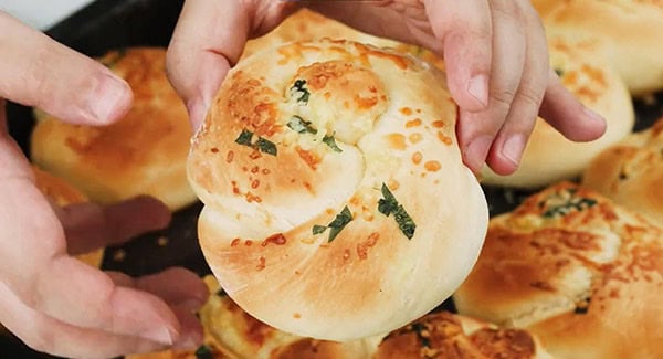 Golden brown garlic parmesan dinner rolls.