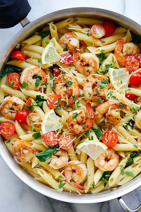 Healthy Cajun marinated-shrimps pasta with with cherry tomatoes and spinach recipe.